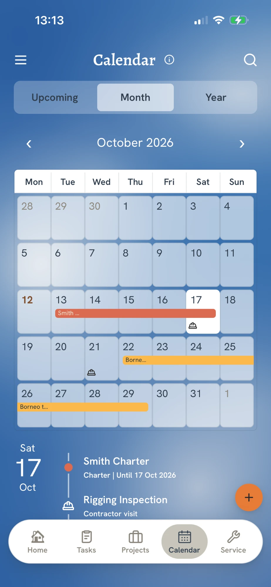 The Calendar screen in the app: a month view of October 2026 with a charter and a contractor visit marked, and the day's events listed underneath